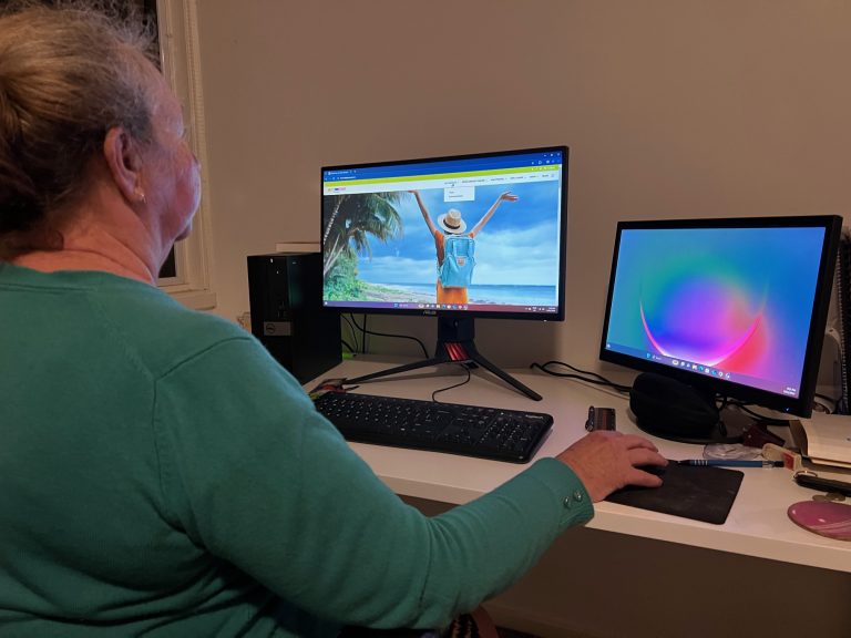 Sharyn with her computer set up to write about travel